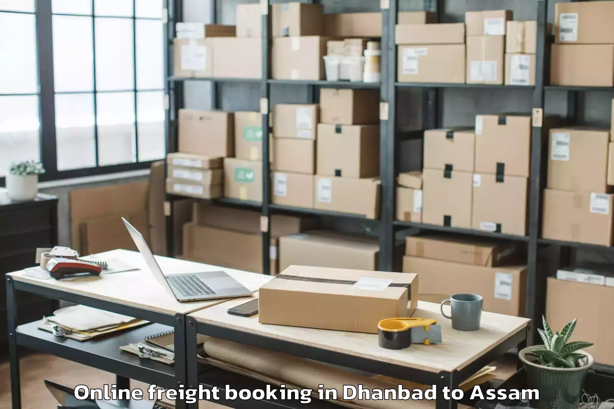 Professional Dhanbad to Bokajan Online Freight Booking